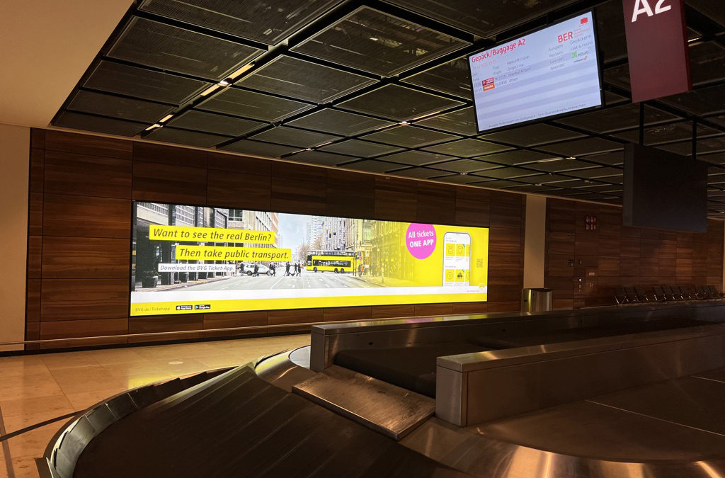 It shows a landscape area at BER airport. It shows the advertisement of the BVG.