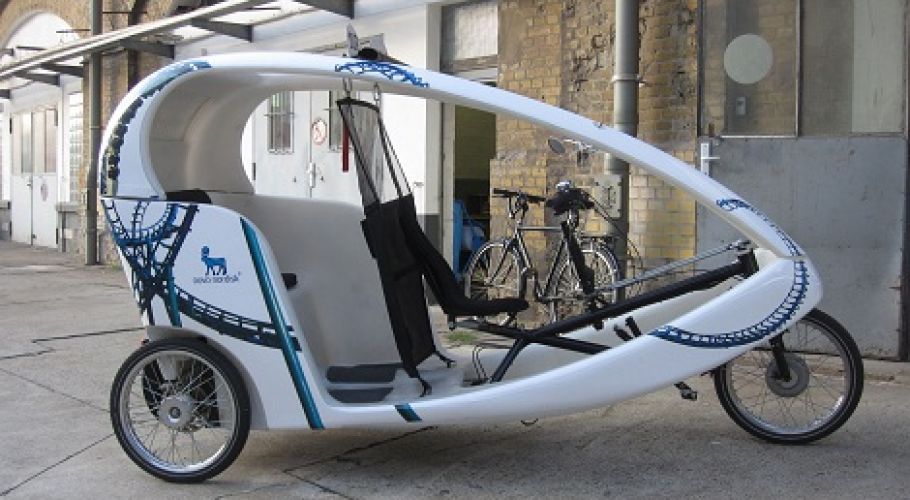 A cab bike in Berlin, it shows the advertisement of the company Novo Nordisk.